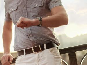 man checking the time on his watch